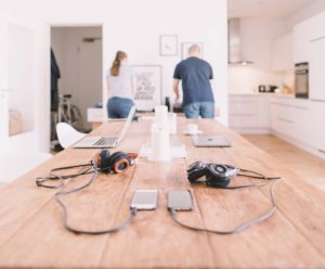 Two people working together in a bright, modern kitchen space.