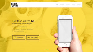Hand holding a smartphone on a yellow background with website navigation.