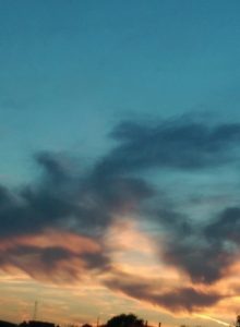 Colorful sunset sky with clouds.