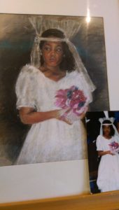 Bride in a white wedding dress holding a bouquet.