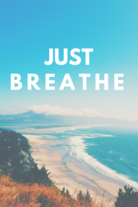 Scenic beach view with 'JUST BREATHE' text overlaid.