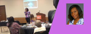 A speaker addresses an audience at a JMG event in a conference room.